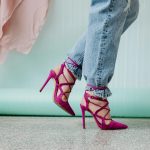high heels for women jeans and vibrant pink stilettos, embodying modern style.